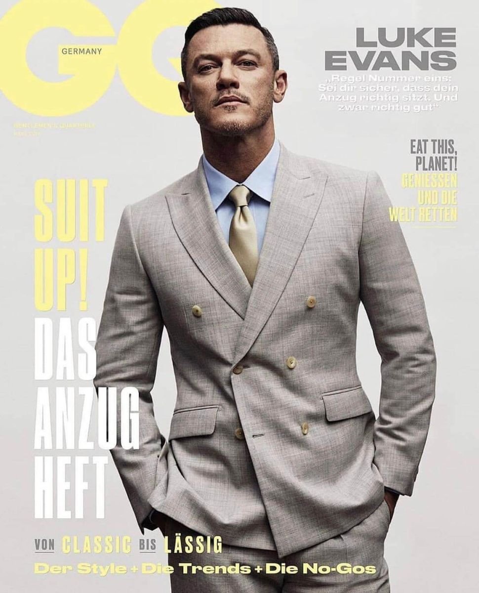 Luke Evans in a grey double-breasted suit on the cover of GQ Germany