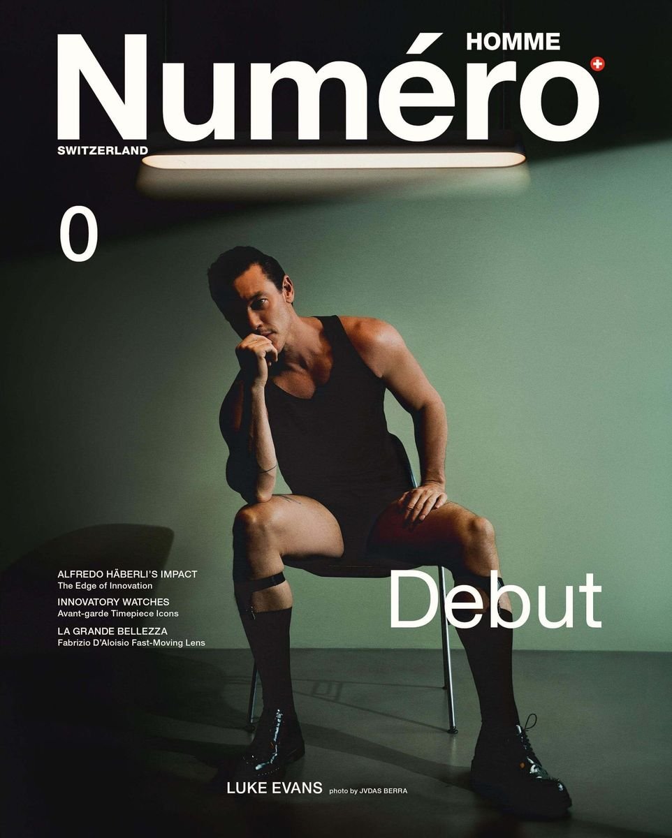 Luke Evans seated on a chair on the cover of Numéro Homme Switzerland